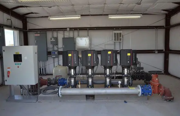 A group of water pumps in a room.